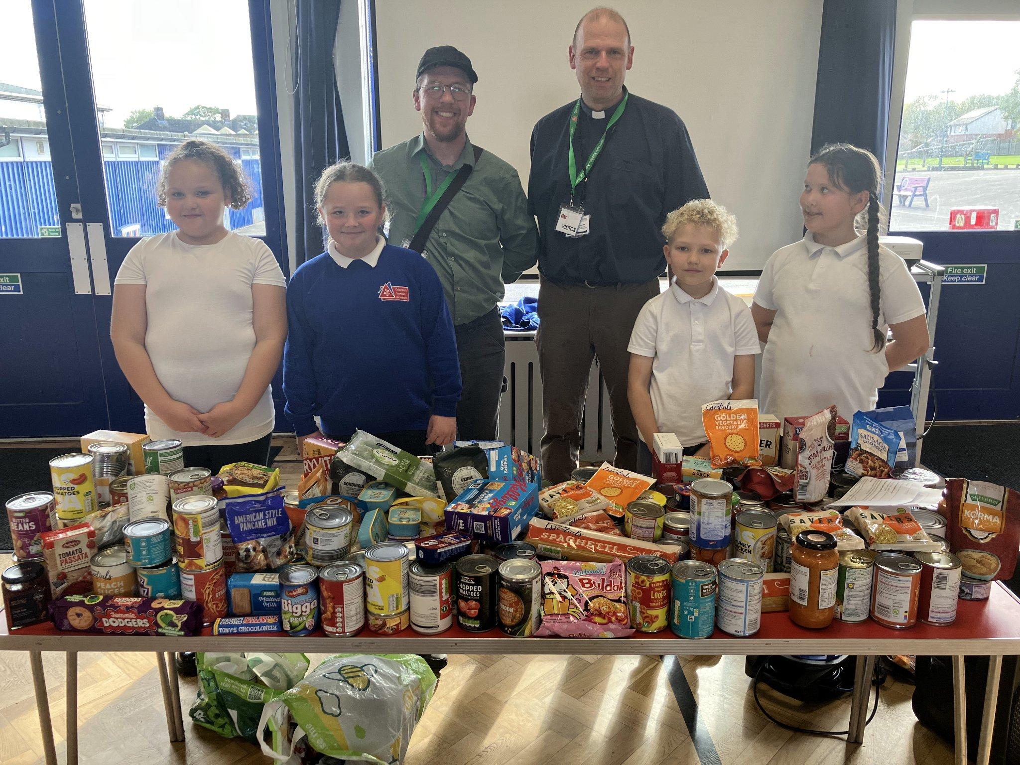 Collecting food at Harvest for the local food bank.